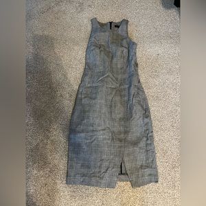 Pencil dress. Small slit on one side.